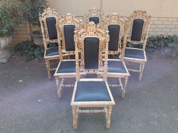 A 19th Century French Set of Six Ornately Carved Oak Chairs in a Contemporary Bleached Finish and Upholstered in Leather - Image 4