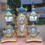 A 19th Century French  Gilt Metal And Porcelain Clock Garniture Set On Original Giltwood Bases And Original Key