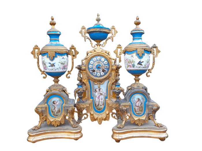 A 19th Century French  Gilt Metal And Porcelain Clock Garniture Set On Original Giltwood Bases And Original Key