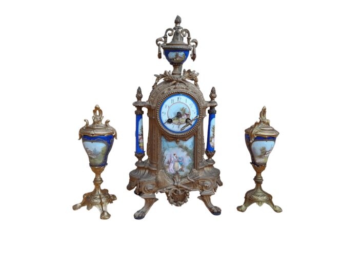 A 19th Century French Garniture Set With Gilt Bonze Clock With Key  And Pair Of Gilt Metal Porcelain Garniture On Velvet Bases