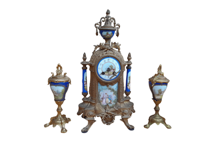 A 19th Century French Garniture Set With Gilt Bonze Clock With Key  And Pair Of Gilt Metal Porcelain Garniture On Velvet Bases
