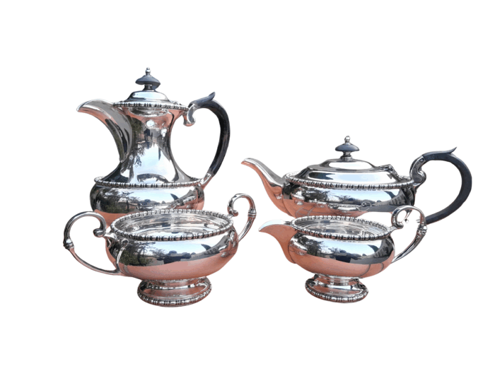 A 20th Century Silver-Plated Walker and Hall 4 piece Tea Set with Wooden Handles