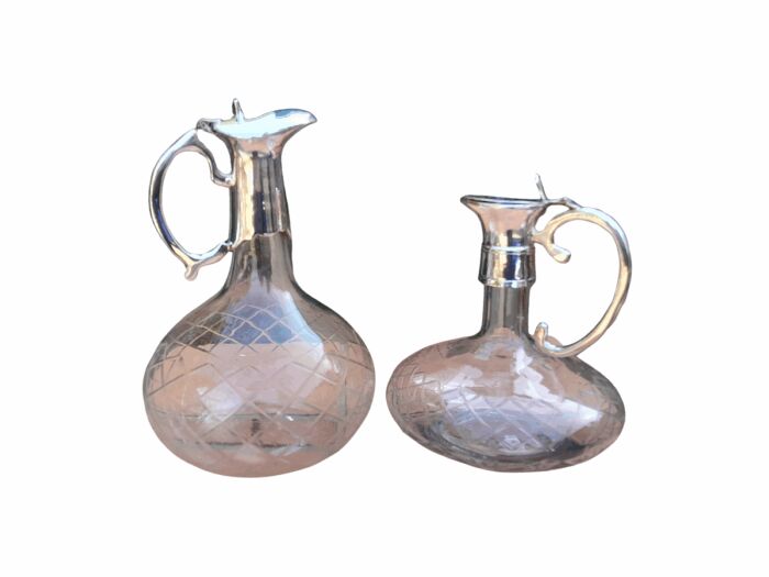 An Early 20th Century Set of Two Silver-Plated Crystal Claret Jugs
