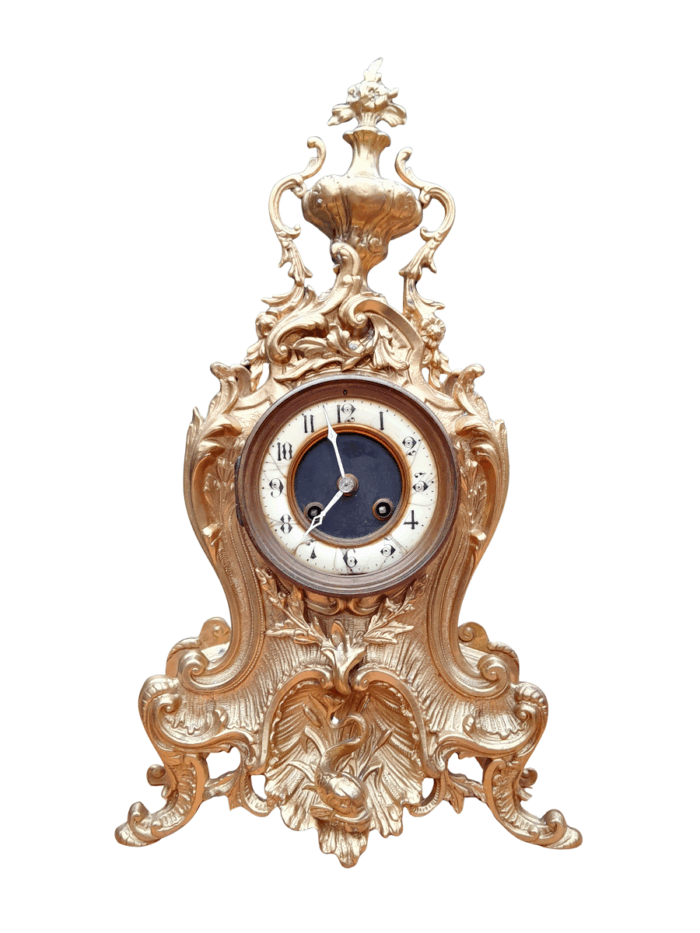 An Antique French Rococo Style Ormolu Clock with Key