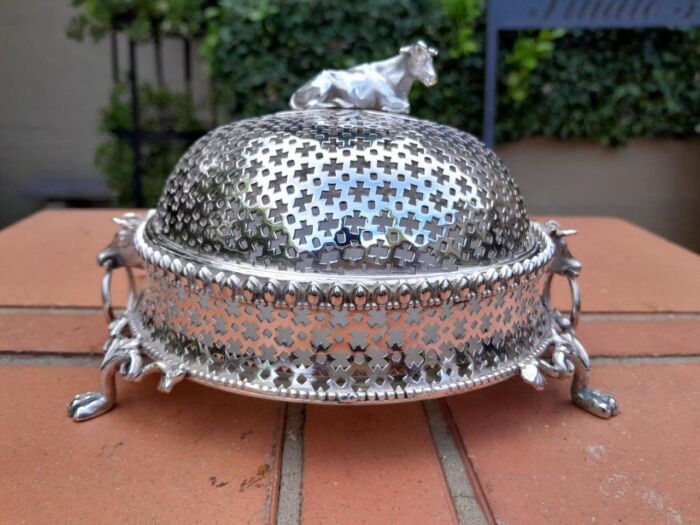 A 20th Century Electroplate Butter Dish With Cow Finial And Animal Handles With Glass Inner