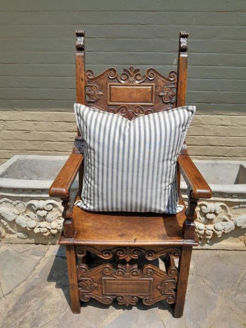 A Grey & White Stripped Cushion