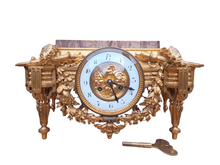 A 19th Century French Gilt Metal with Marble Top Clock