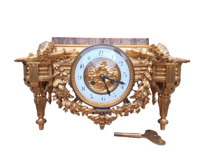 A 19th Century French Gilt Metal with Marble Top Clock