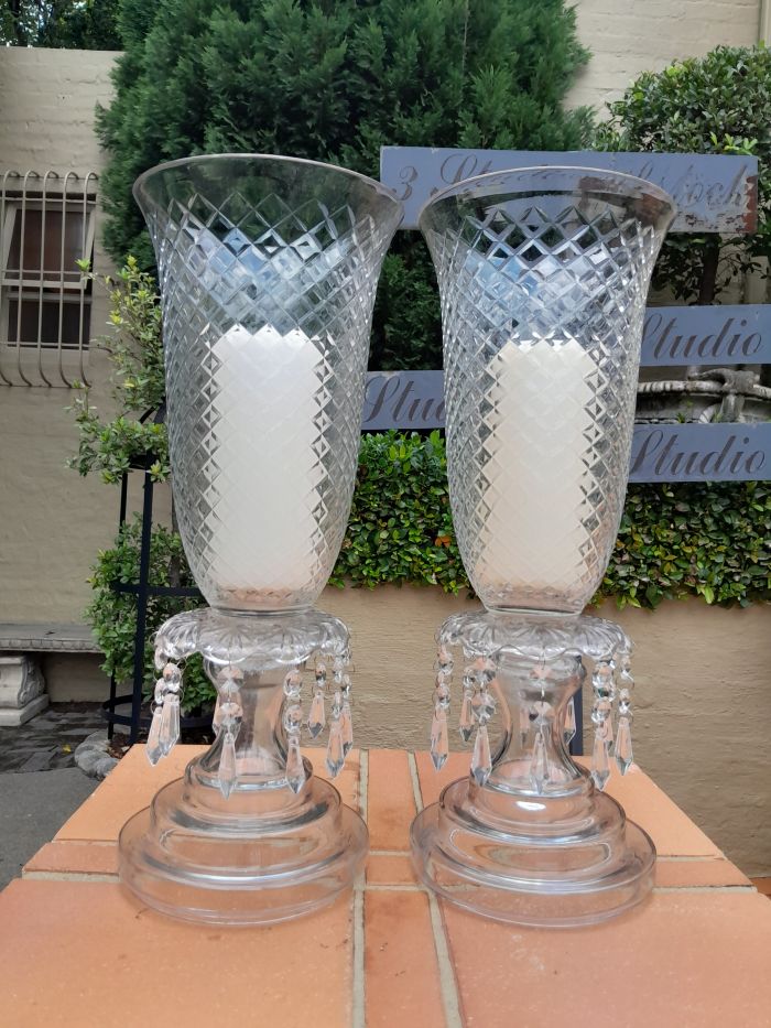 A Pair Of French Style Candle Holders With Candles