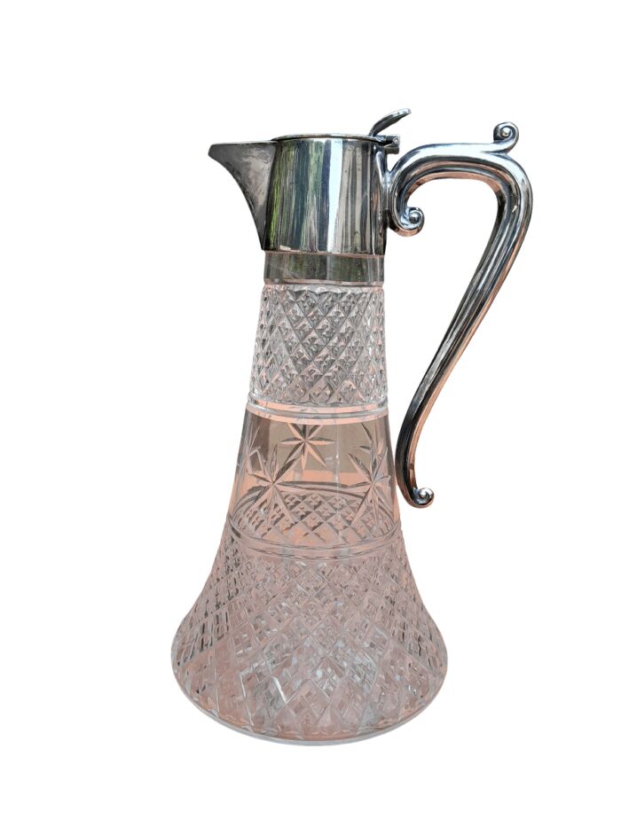 An Antique Crystal and Silver Plated Claret Jug