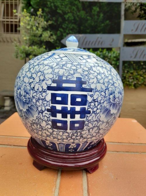 A Blue and White Porcelain Chinese Lidded Jar on Wooden Stand