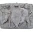 A Concrete Relief Plaque Sculpture With Putti (Cherubs) Holding A Crest