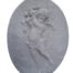 A Concrete Relief Oval Sculpture Of An Ornate Cherub Plaque