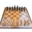 An Olive Wood Chess Board With Carved Chess Pieces In A Box