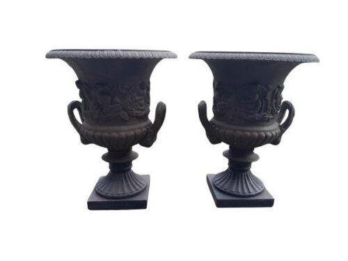 A 20TH Century French Pair Of Ornately Carved Cast Iron Urns With Handles