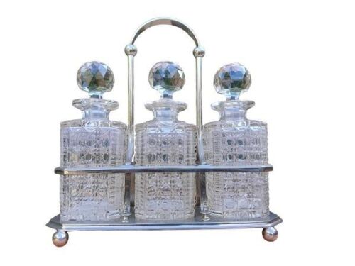 A 20th Century Silver Plated Tantalus With Three Crystal Decanters
