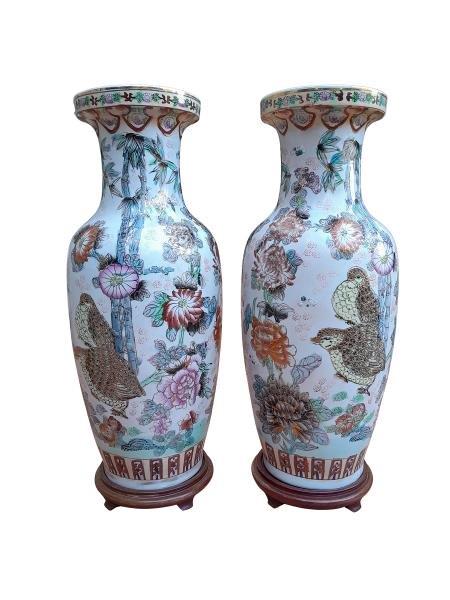 A 20th Century Pair Of Chinese Famille Rose Vases On Wooden Stands Of Large Proportions