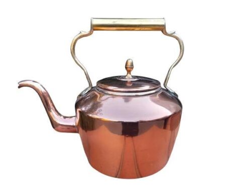 A Copper Kettle with Brass handle