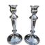 A Pair Of Silver Plated Candlesticks With Sconces