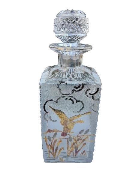 A Cut Crystal Decanter With Gilt And Silver Duck