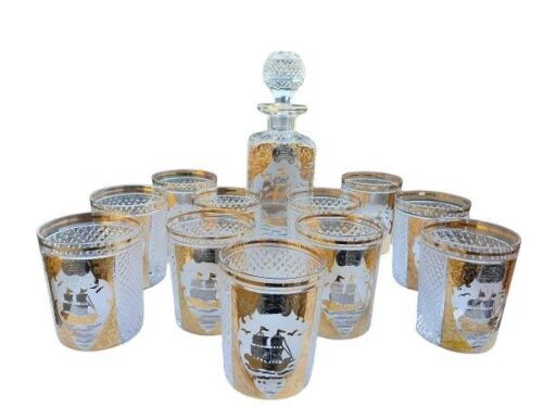 A Set Of A Cut Crystal Decanter  With Eleven Matching Tumbler Glasses