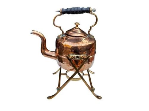 A Copper Kettle On Brass Stand