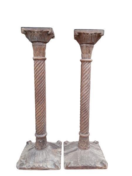 A 20th Century Pair Of Teak Candle Sticks