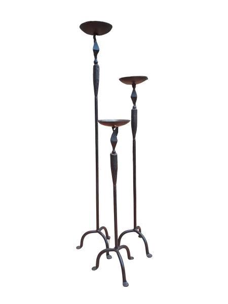 A 20th Century Set of Three Forged Iron Candle Stands