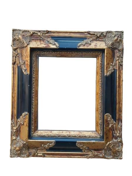 A Louis XIV Style Baroque Giltwood And Ebonised Mirror
