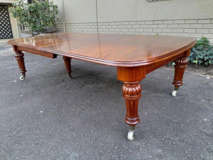 An Antique Victorian Oak Dining Table on Porcelain Castors with Two Leaves (10 Seater) - Image 3