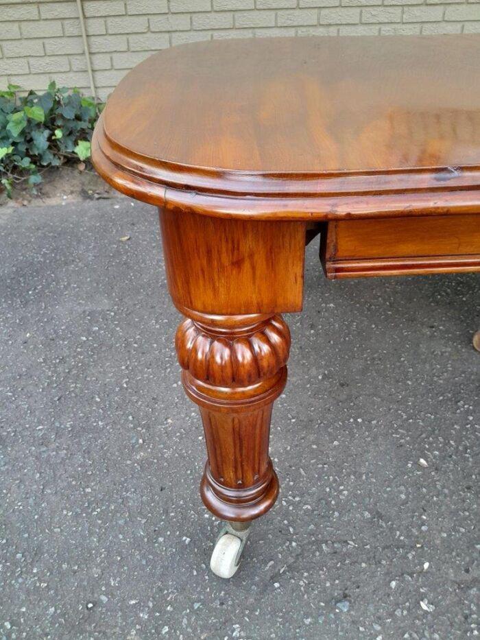 An Antique Victorian Oak Dining Table on Porcelain Castors with Two Leaves (10 Seater) - Image 5