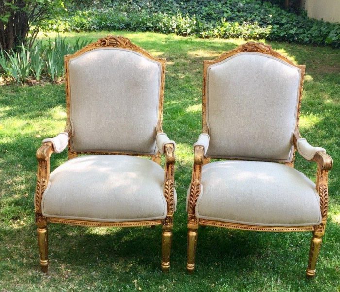 A Pair of French Louis XVI Styled Ornately carved and gilded Fautelli  Chairs in Linen Upholstery - Image 2