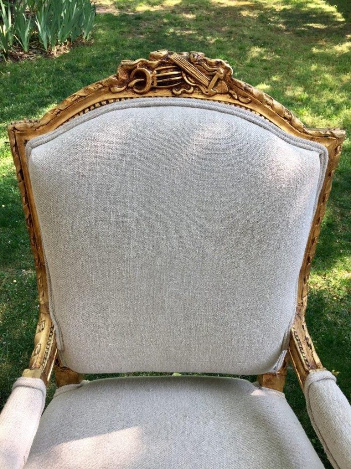 A Pair of French Louis XVI Styled Ornately carved and gilded Fautelli  Chairs in Linen Upholstery - Image 3
