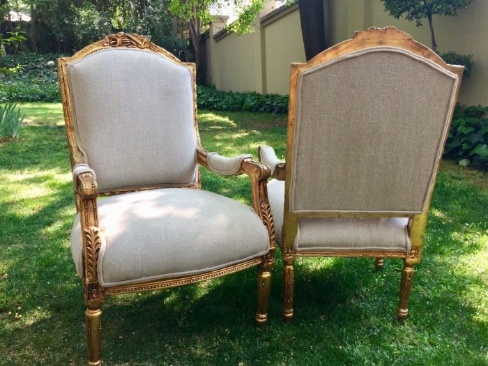 A Pair of French Louis XVI Styled Ornately carved and gilded Fautelli  Chairs in Linen Upholstery - Image 5