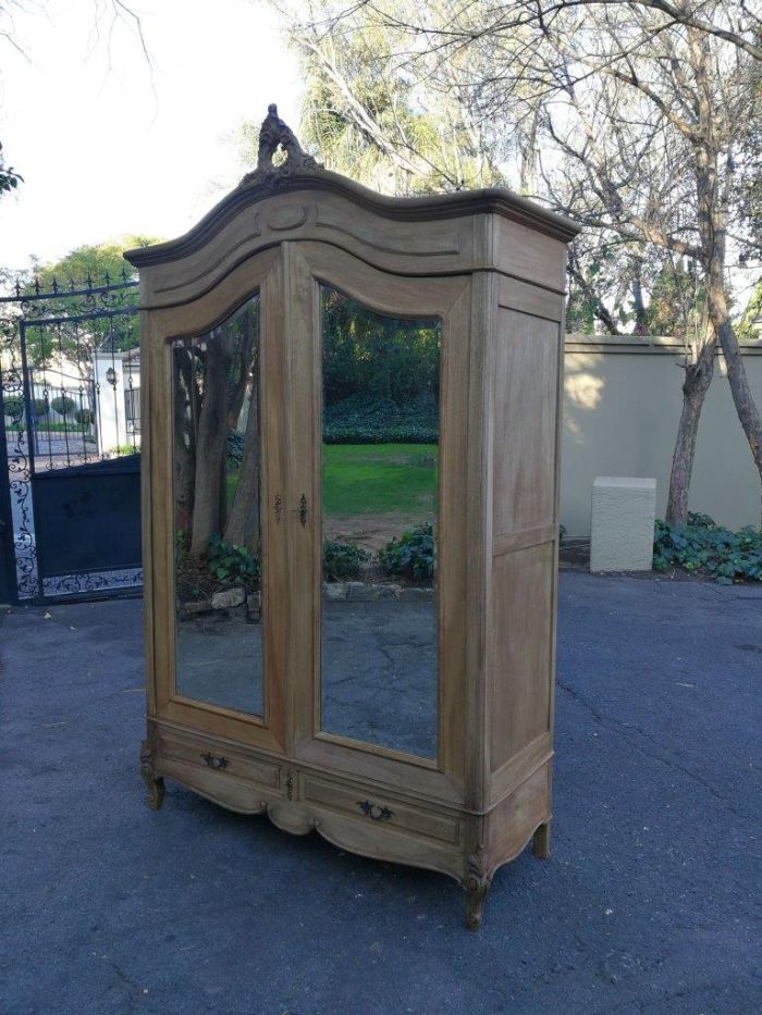 A 20th Century French Rococo Style Armoire with Bevelled Mirrors and Drawers finished in a contemporary Bleached / Natural Wood - Image 3