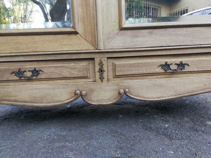 A 20th Century French Rococo Style Armoire with Bevelled Mirrors and Drawers finished in a contemporary Bleached / Natural Wood - Image 7