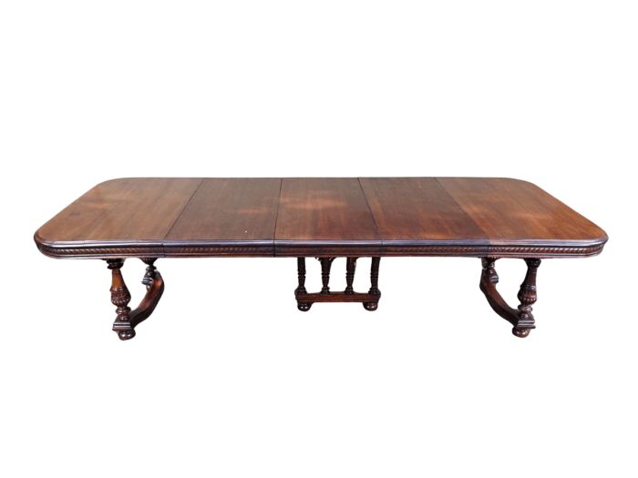 Renaissance Henry II dining table with carved and turned legs and a middle stretcher. Late 19th century table (10-12-Seater) With 3 Leaves