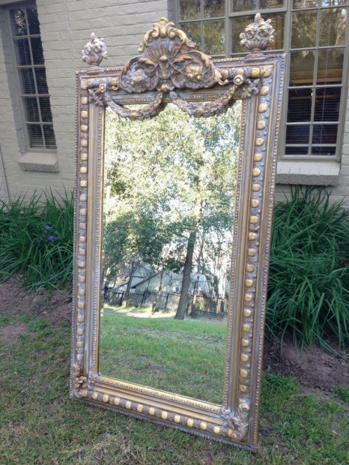An Ornate Carved Painted Mirror