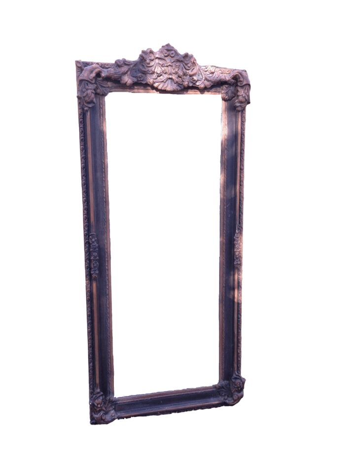 An Ornate Carved Bevelled Mirror