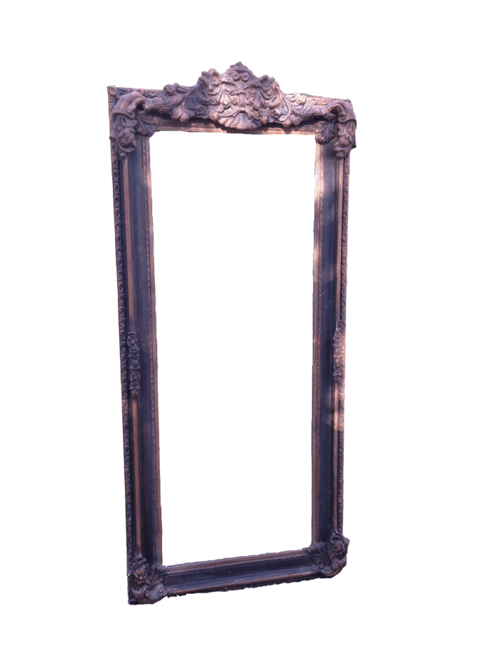 An Ornate Carved Bevelled Mirror