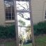 An Ornate Carved & Bevelled Painted Mirror