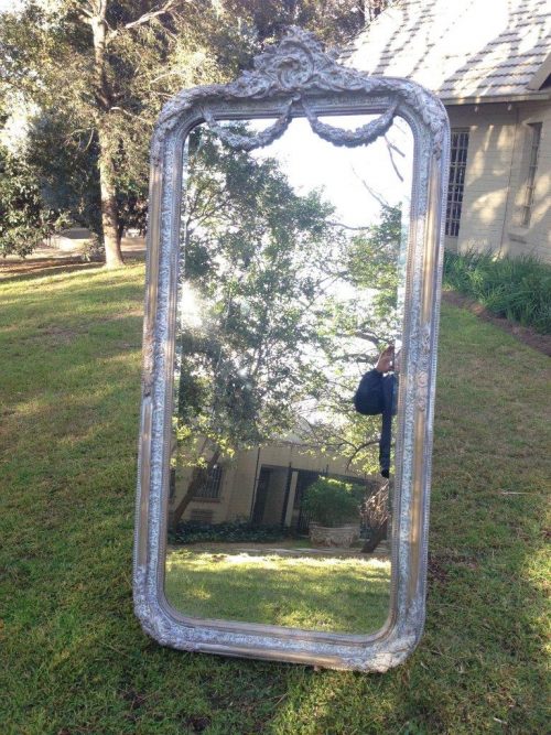 An Ornate Carved & Bevelled Painted Mirror