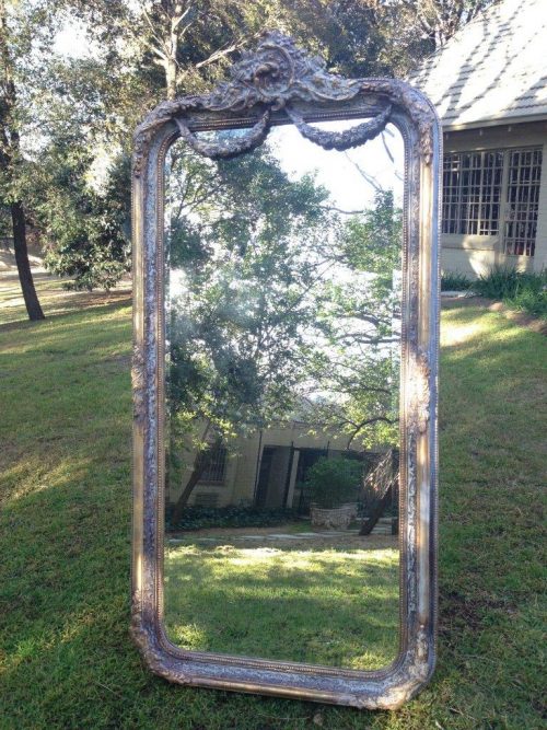 An Ornate Carved & Bevelled Painted Mirror