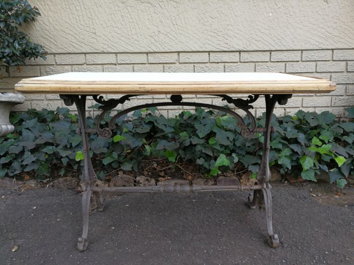 A Victorian Cast-Iron And Bleached / Natural Pine Table with marble top ND