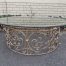 Round wrought iron coffee table with glass top with thick bevelled glass top