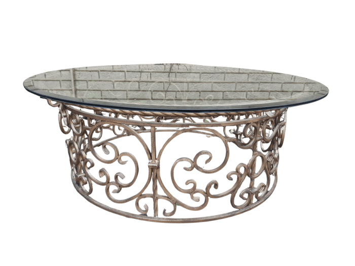Round wrought iron coffee table with glass top with thick bevelled glass top
