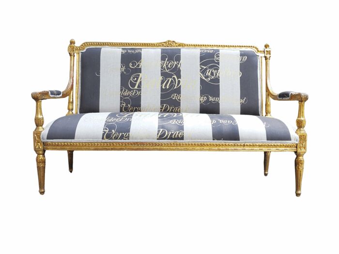 A 20th Century French Style Ornate Hand-Carved and Gilded Settee / Sofa Upholstered in a Custom-made Imported Fabric for The Crown Collection