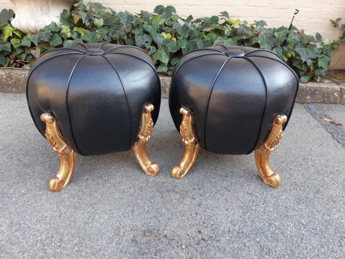 Pair Of Ottomans/Tuffets upholstered in leather and hand-gilded With 22-Karat gold-leaf
