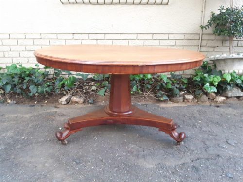Victorian circular tilt-top table on castors