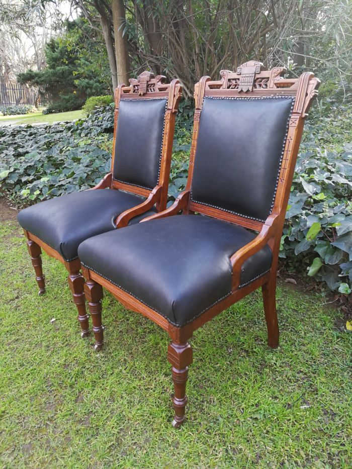 A Late 19th Century Pair of Victorian Carved Walnut Chairs Upholstered in Leather on Casters - Image 3